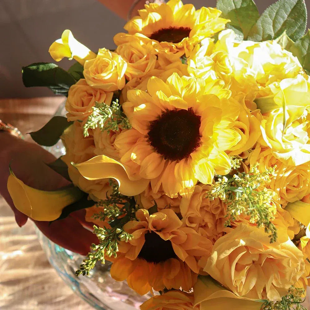 Bright yellow sunflower and rose bouquet, perfect for celebrations and special occasions.