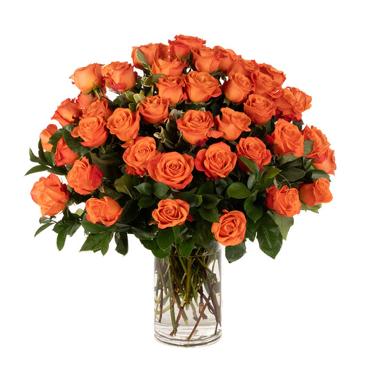 Vibrant bouquet of 50 orange roses in a clear glass vase, perfect for celebrations or special occasions.
