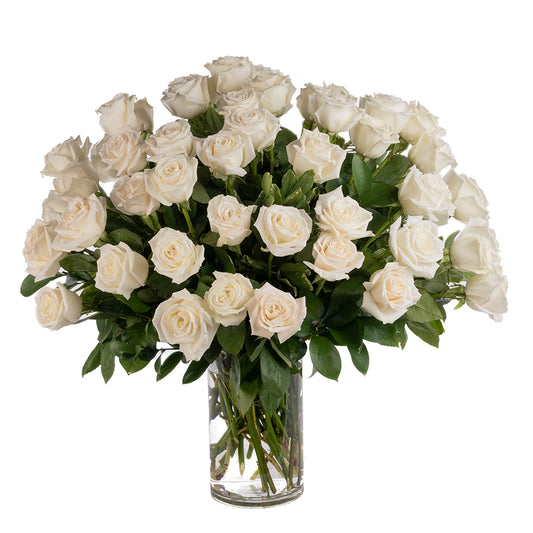 Elegant bouquet of 50 white roses in a glass vase, perfect for weddings or special occasions.