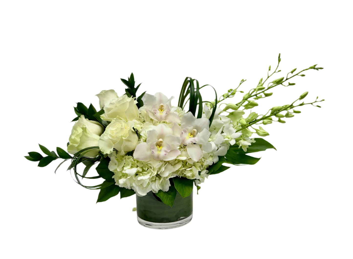 Elegant white floral arrangement featuring roses, orchids, and hydrangeas in a stylish glass vase.