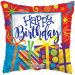 A colorful birthday-themed balloon pillow with the text 'HAPPY BIRTHDAY' displayed prominently.