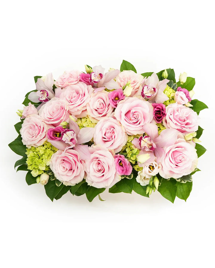 A vibrant arrangement of pink roses, orchids, and delicate greenery, perfect for any special occasion.